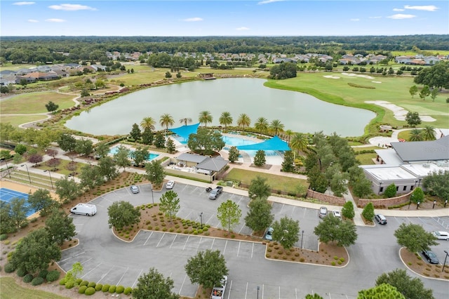 aerial view featuring golf course view and a water view