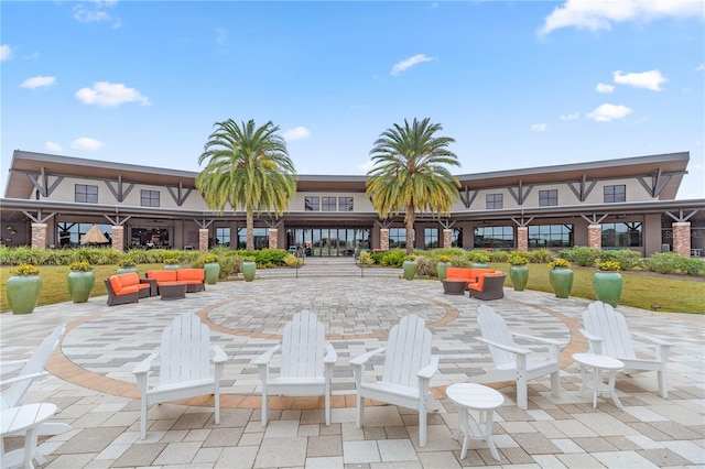 view of community featuring a patio and an outdoor hangout area