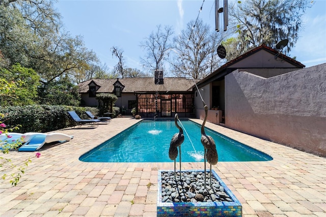 pool with a patio area