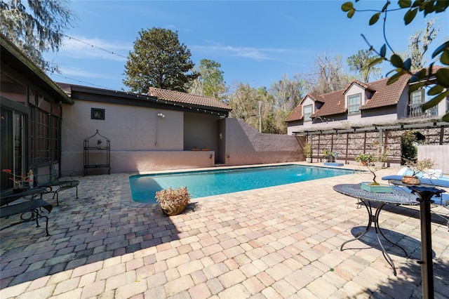 view of pool featuring a patio, fence, and a fenced in pool