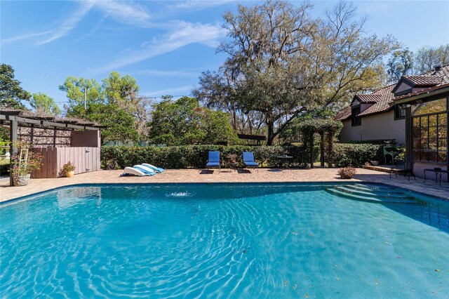 view of swimming pool featuring a fenced in pool and fence