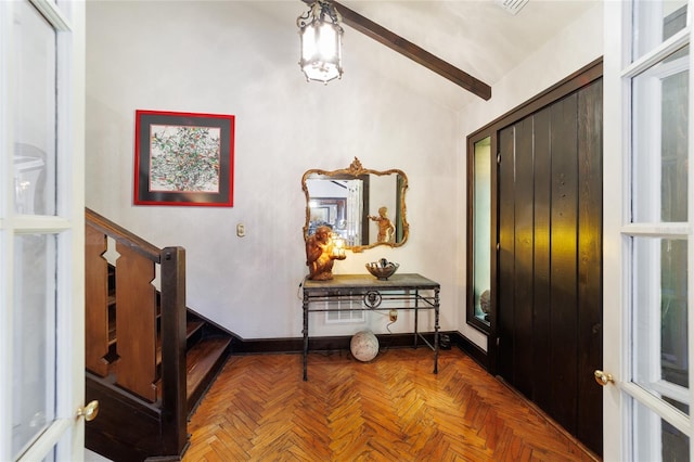 entryway featuring stairs and baseboards