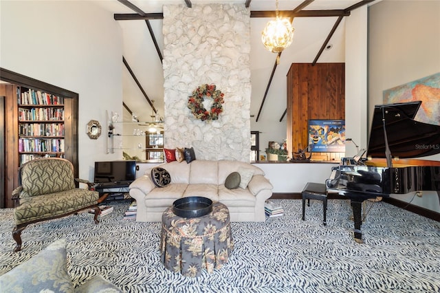 living room featuring a chandelier, beamed ceiling, and a towering ceiling