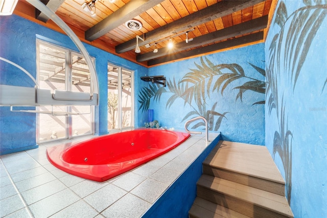 bathroom featuring visible vents, track lighting, tiled tub, wooden ceiling, and beamed ceiling