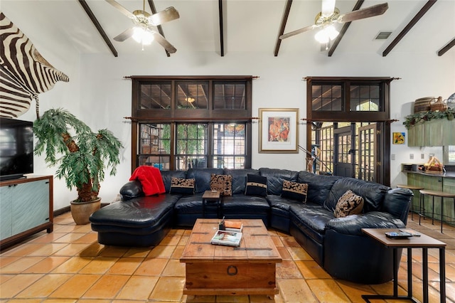 living area featuring a ceiling fan, french doors, visible vents, and beam ceiling