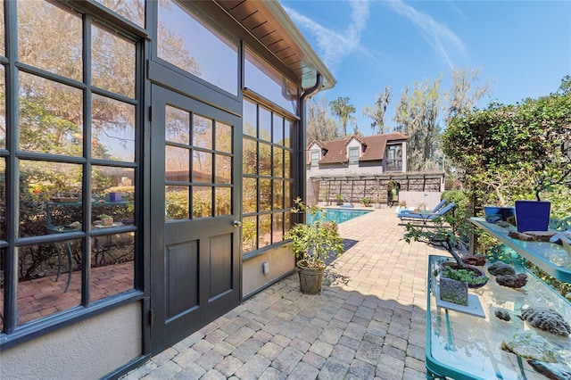 view of patio / terrace with a fenced in pool