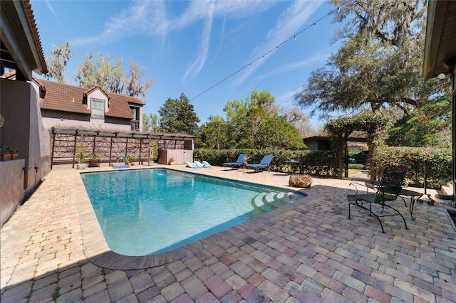 view of pool with a fenced in pool and a patio