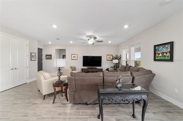 living room with visible vents, baseboards, a ceiling fan, and recessed lighting