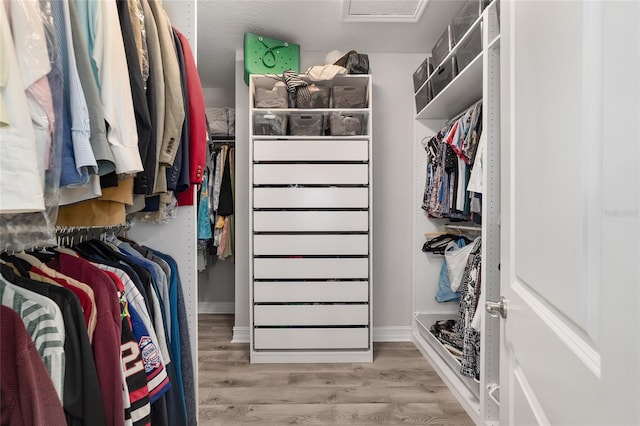 spacious closet with wood finished floors