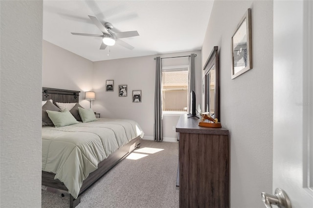 bedroom with carpet, baseboards, and a ceiling fan