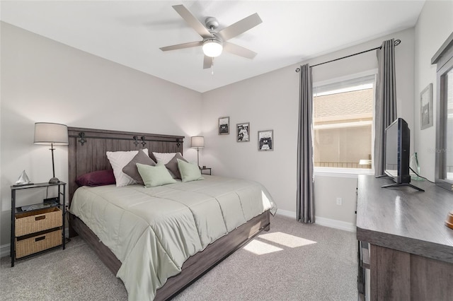 bedroom with ceiling fan, carpet flooring, and baseboards