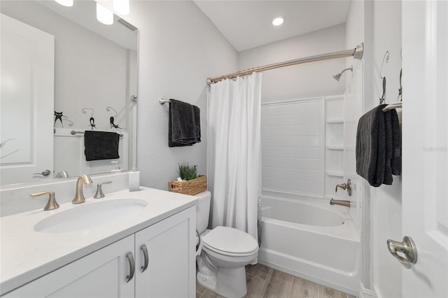 full bath with visible vents, toilet, wood finished floors, shower / bathtub combination with curtain, and vanity