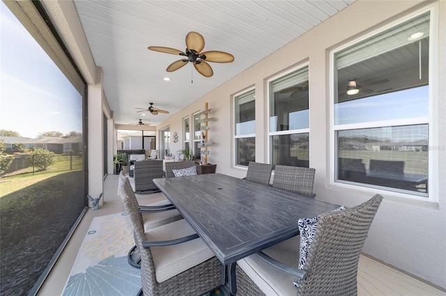 exterior space with a ceiling fan and outdoor dining space