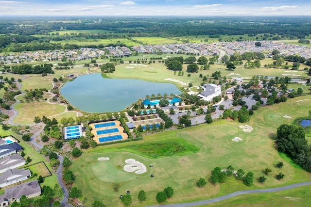 drone / aerial view featuring a residential view, a water view, and golf course view