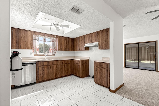 kitchen featuring ceiling fan, under cabinet range hood, a sink, visible vents, and dishwasher