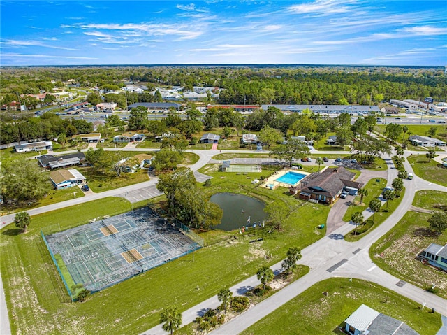 aerial view featuring a water view and a view of trees