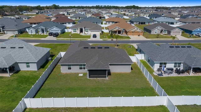 birds eye view of property with a residential view