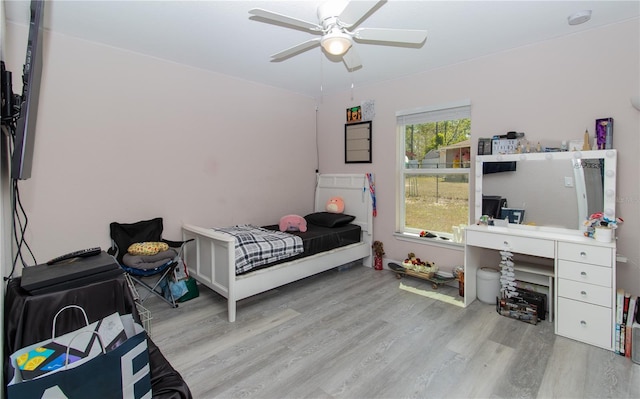 bedroom featuring a ceiling fan and wood finished floors