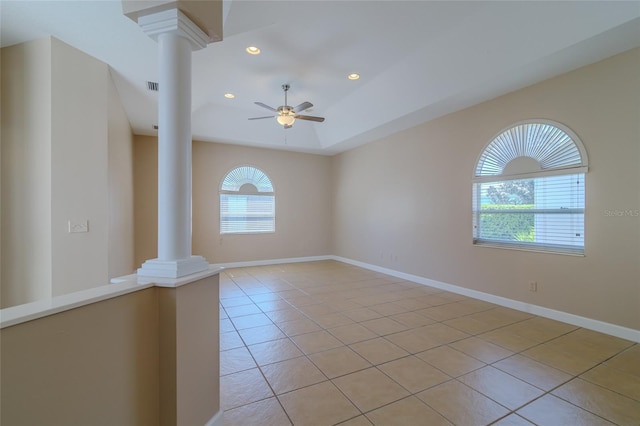 empty room featuring ceiling fan, light tile patterned flooring, recessed lighting, baseboards, and decorative columns