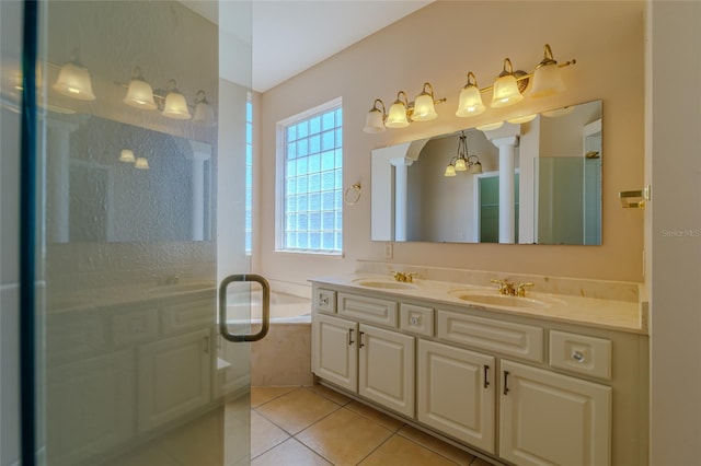 bathroom with a shower, tile patterned flooring, and a sink