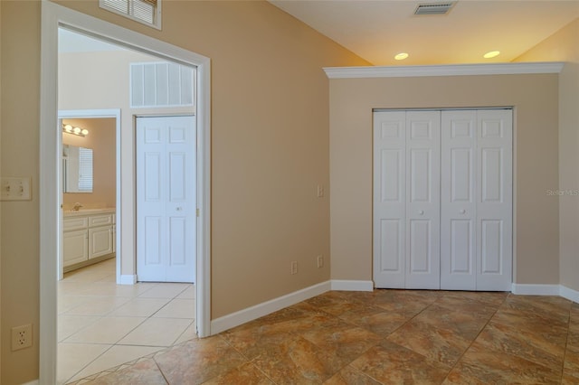 unfurnished bedroom featuring baseboards, visible vents, and recessed lighting