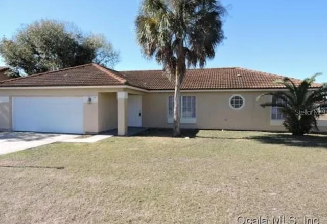 ranch-style house with stucco siding, a front lawn, concrete driveway, a garage, and a tile roof