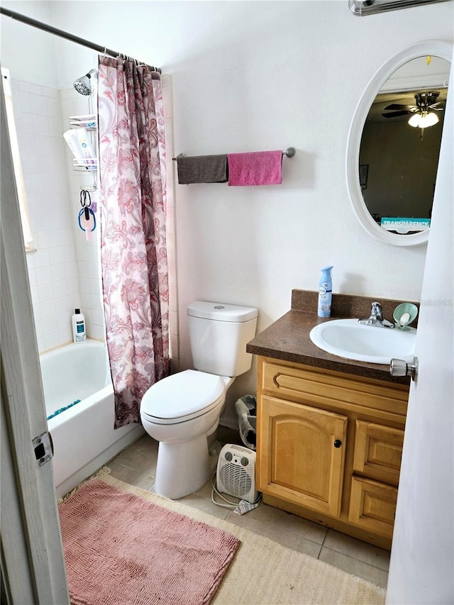 bathroom with tile patterned flooring, toilet, vanity, and shower / bath combo