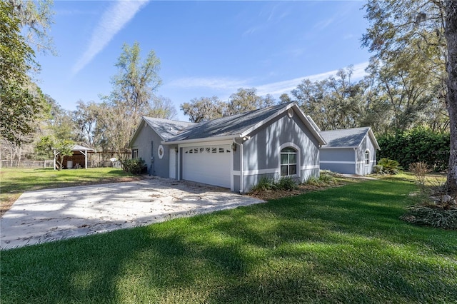 view of front facade with an attached garage, driveway, and a front lawn