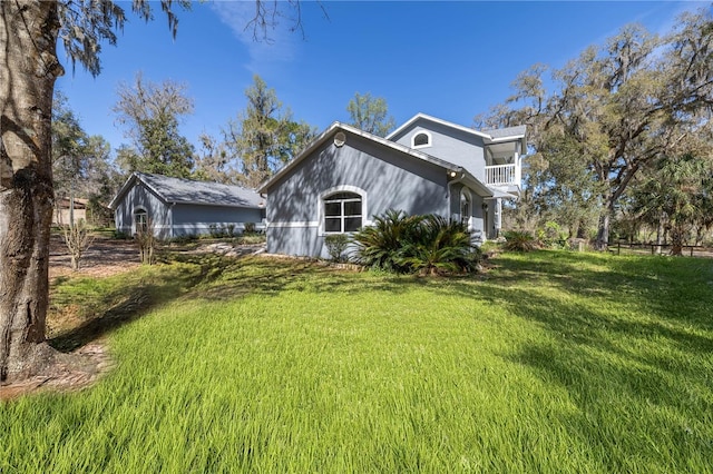 view of home's exterior with a yard