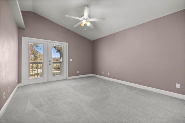 unfurnished room featuring french doors, light carpet, vaulted ceiling, and baseboards