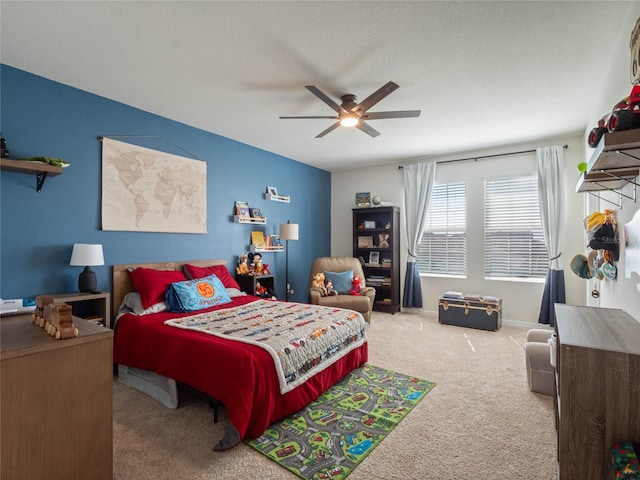 bedroom featuring ceiling fan, a textured ceiling, carpet, and baseboards