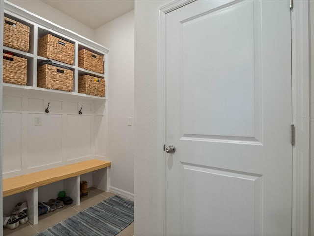 mudroom featuring tile patterned flooring and baseboards