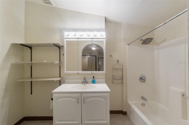 bathroom featuring baseboards, visible vents, shower / bathtub combination, tile patterned floors, and vanity