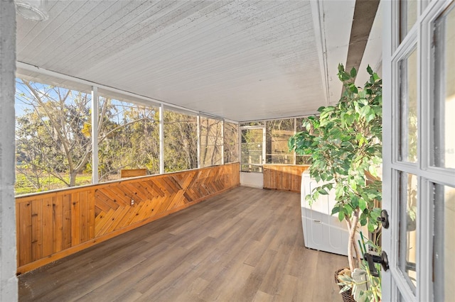 unfurnished sunroom with plenty of natural light