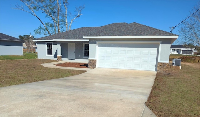 view of front of property with an attached garage, concrete driveway, a front yard, and stucco siding