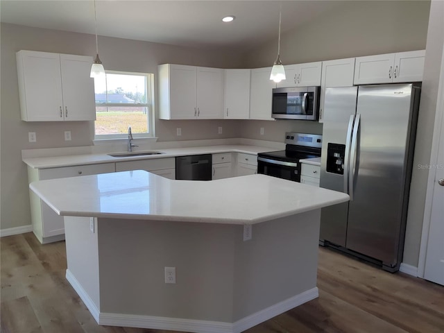 kitchen with white cabinetry, stainless steel appliances, and a sink