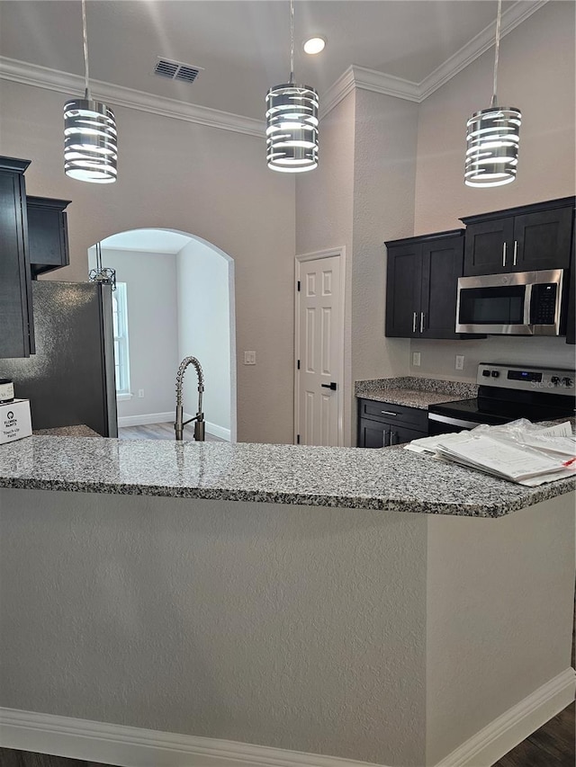 kitchen with ornamental molding, stainless steel appliances, light stone counters, and visible vents