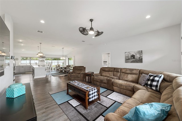 living room featuring a ceiling fan, recessed lighting, visible vents, and dark wood finished floors