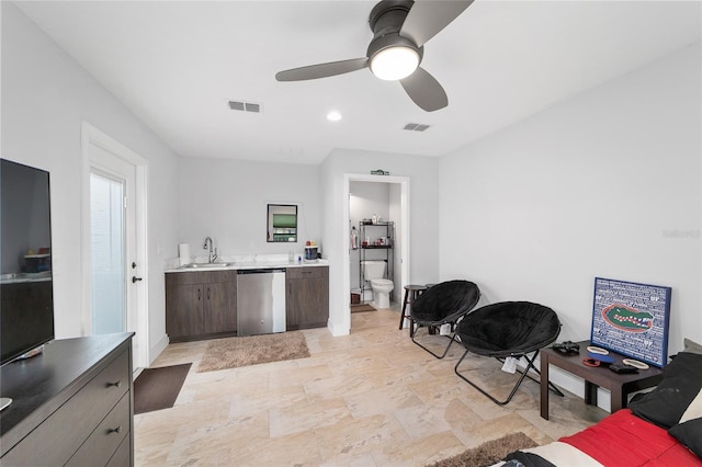 interior space featuring a sink, a ceiling fan, visible vents, and dishwasher