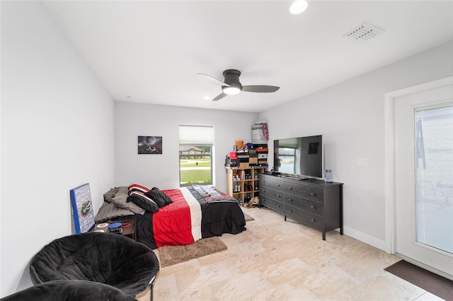 bedroom featuring a ceiling fan, multiple windows, visible vents, and baseboards