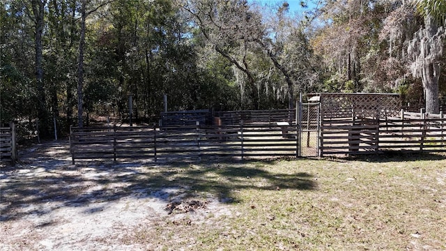 view of gate with fence