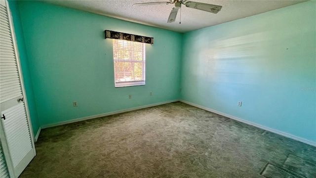 empty room featuring carpet floors, a textured ceiling, baseboards, and a ceiling fan