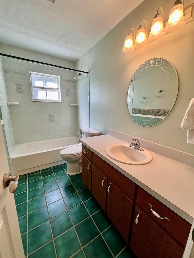 bathroom with a textured ceiling, tile patterned flooring, toilet, vanity, and tub / shower combination