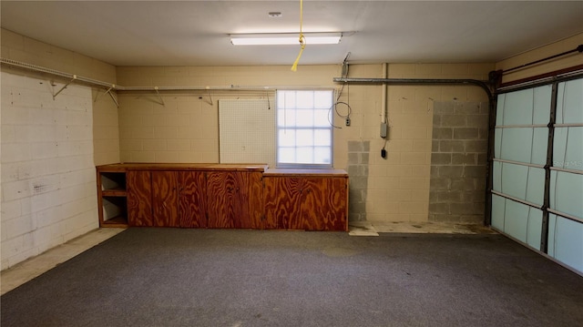 garage featuring concrete block wall