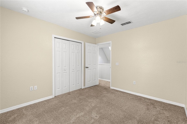 unfurnished bedroom featuring carpet, visible vents, and baseboards