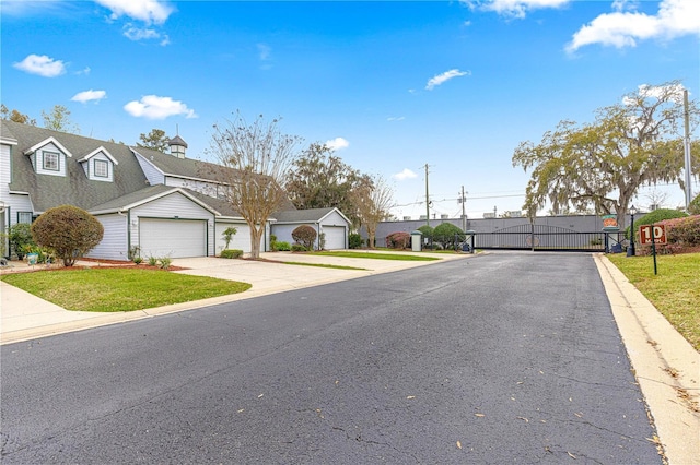 view of road with a gated entry, a residential view, and a gate