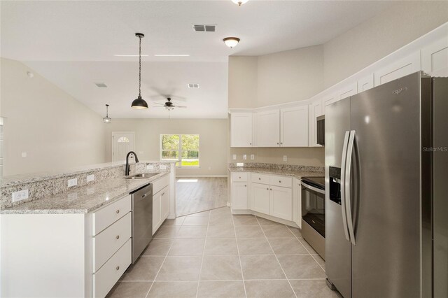 114 Bay Dr, Ocklawaha, FL 32179 - kitchen featuring appliances with stainless steel finishes, white cabinets, ceiling fan, a sink, and hanging light fixtures