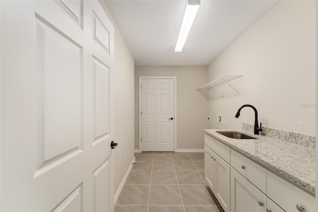 114 Bay Dr, Ocklawaha, FL 32179 - laundry room with washer hookup, light tile patterned floors, baseboards, and cabinet space