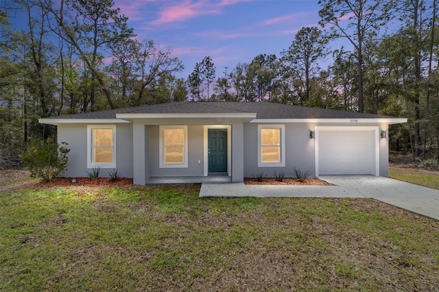 ranch-style house featuring stucco siding, concrete driveway, covered porch, a front yard, and a garage