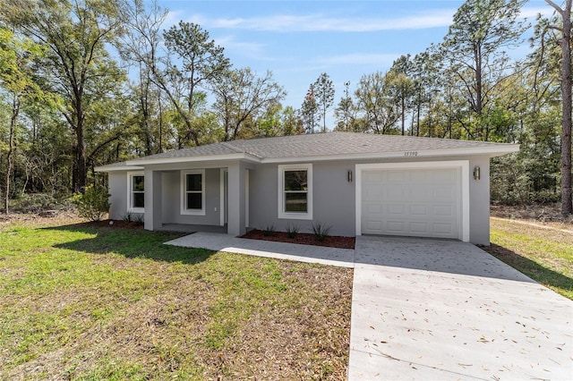 single story home featuring driveway, a garage, a front lawn, and stucco siding